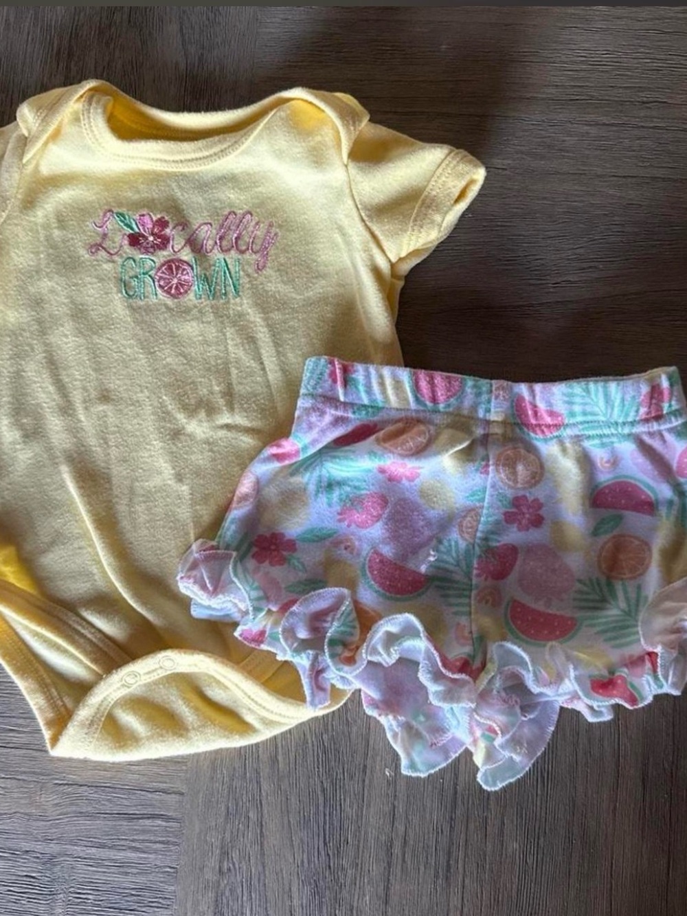 Yellow 'Locally Grown' Baby Onesie & Pastel Fruit Ruffle Shorts Set